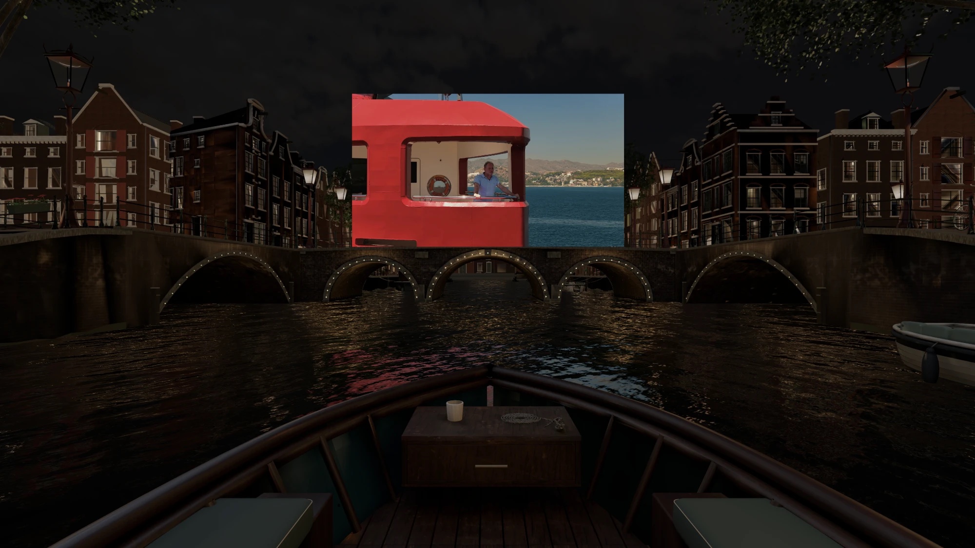 The Amsterdam Canal space: a wooden boat on a night canal, canal houses and lanterns on both sides, and a film playing on a screen above the lit bridge