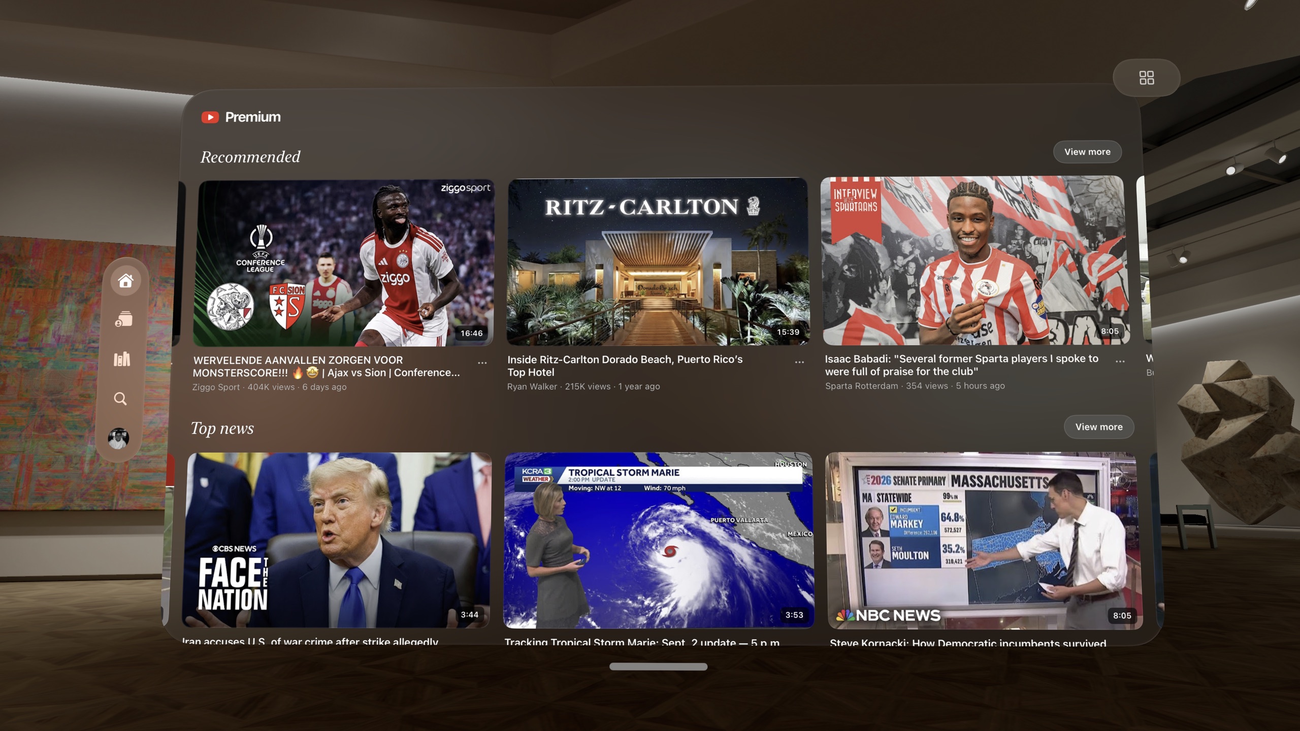 YouTube as its own space inside Suite: the home feed with Recommended and Top news rows and your profile in the rail, in a museum space on Vision Pro